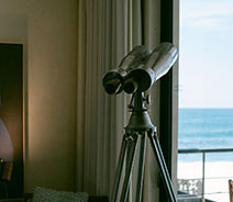 Indoor telescope facing the sea